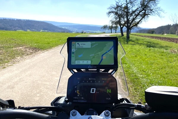 Screen of a motorbike with Android Auto navigation running.